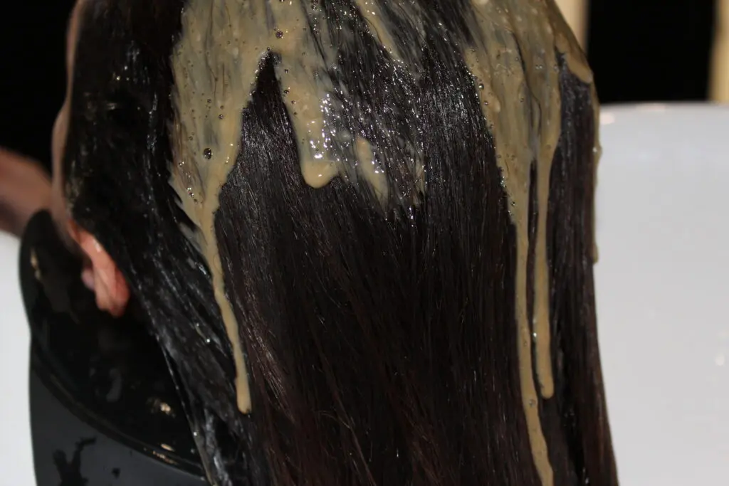 a color melt on a client hair model for the associate program