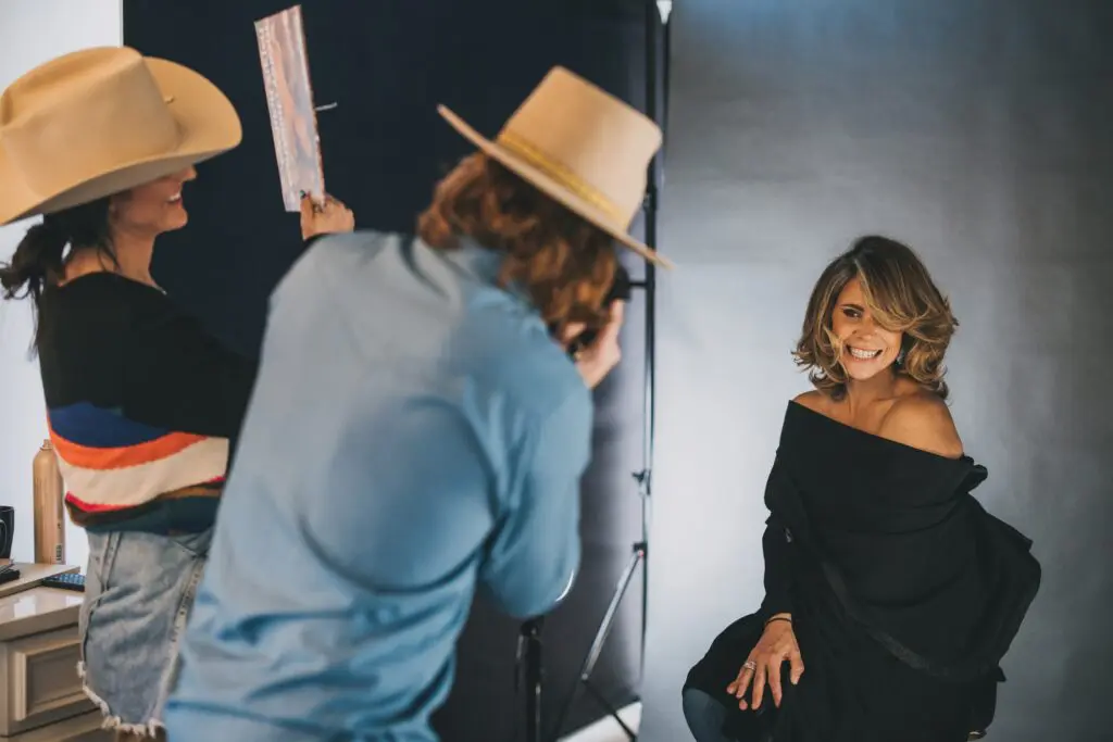 Behind-the-scenes photo of EGGIE Salon Studio client photoshoot featured in inRegister Magazine.