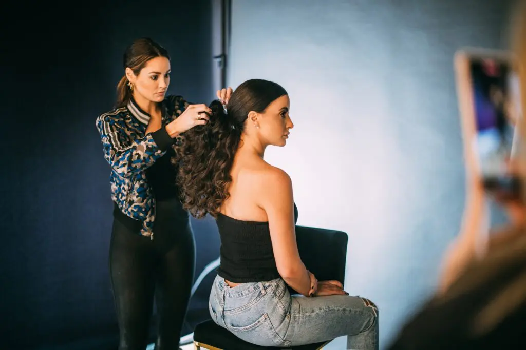 Behind-the-scenes photo of EGGIE Salon Studio client photoshoot featured in inRegister Magazine.