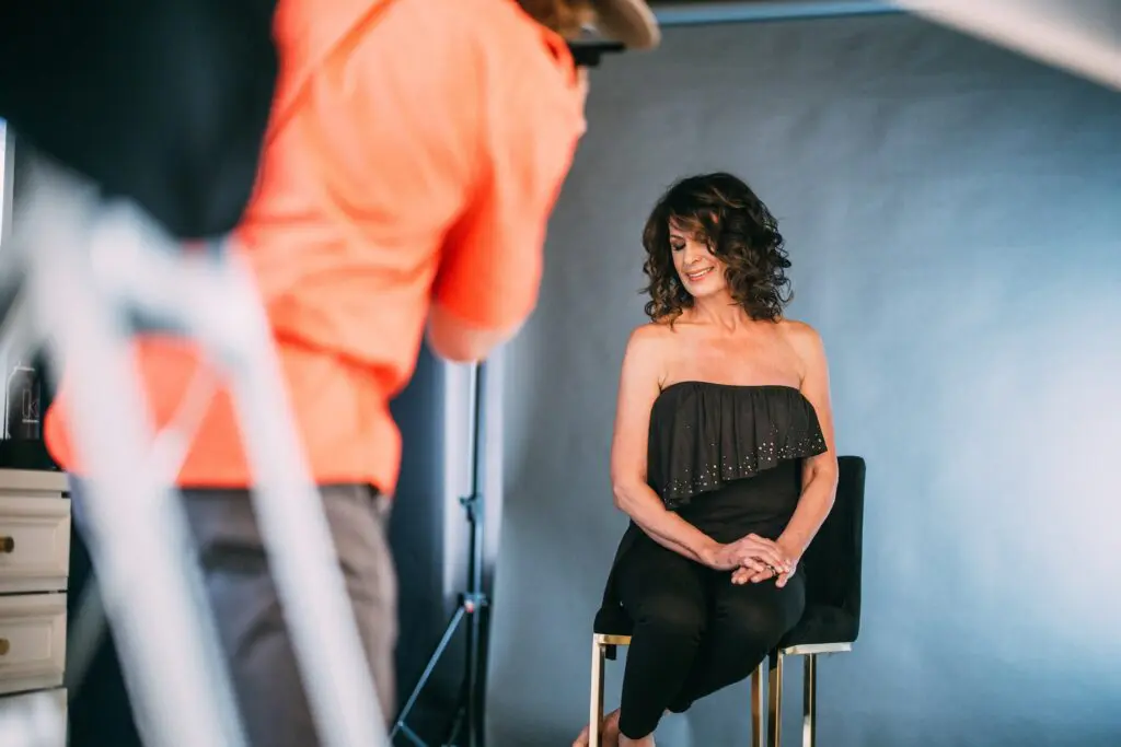 Behind-the-scenes photo of EGGIE Salon Studio client photoshoot featured in inRegister Magazine.